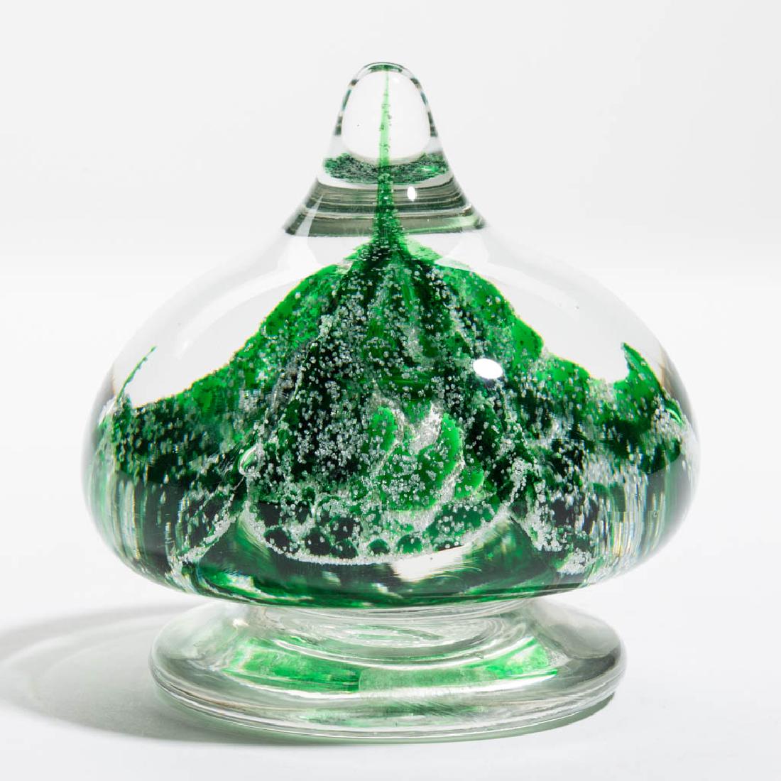 JOE ZIMMERMAN MOTTLED AND MICA MAGNUM PAPERWEIGHT: JOE ZIMMERMAN MOTTLED AND MICA MAGNUM PAPERWEIGHT, compressed teardrop form, with five fluted segments of green and mica decoration, applied circular base, double signed. 20th century. 4" HOA, 3 1/2" 