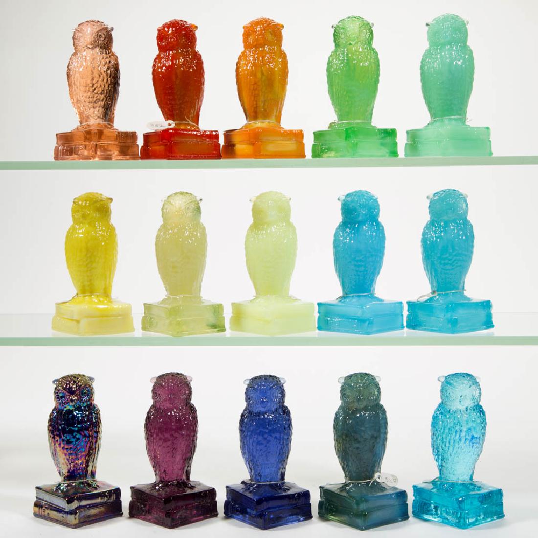 DEGENHART GLASS OWL FIGURES, LOT OF 15: DEGENHART GLASS OWL FIGURES, LOT OF 15, various colors, including a Milk Blue, an April Green, a Fantastic, an iridescent Cobalt Carnival, and a Lemon Chiffon. Each with Degenhart "D" mark. Crystal Ar