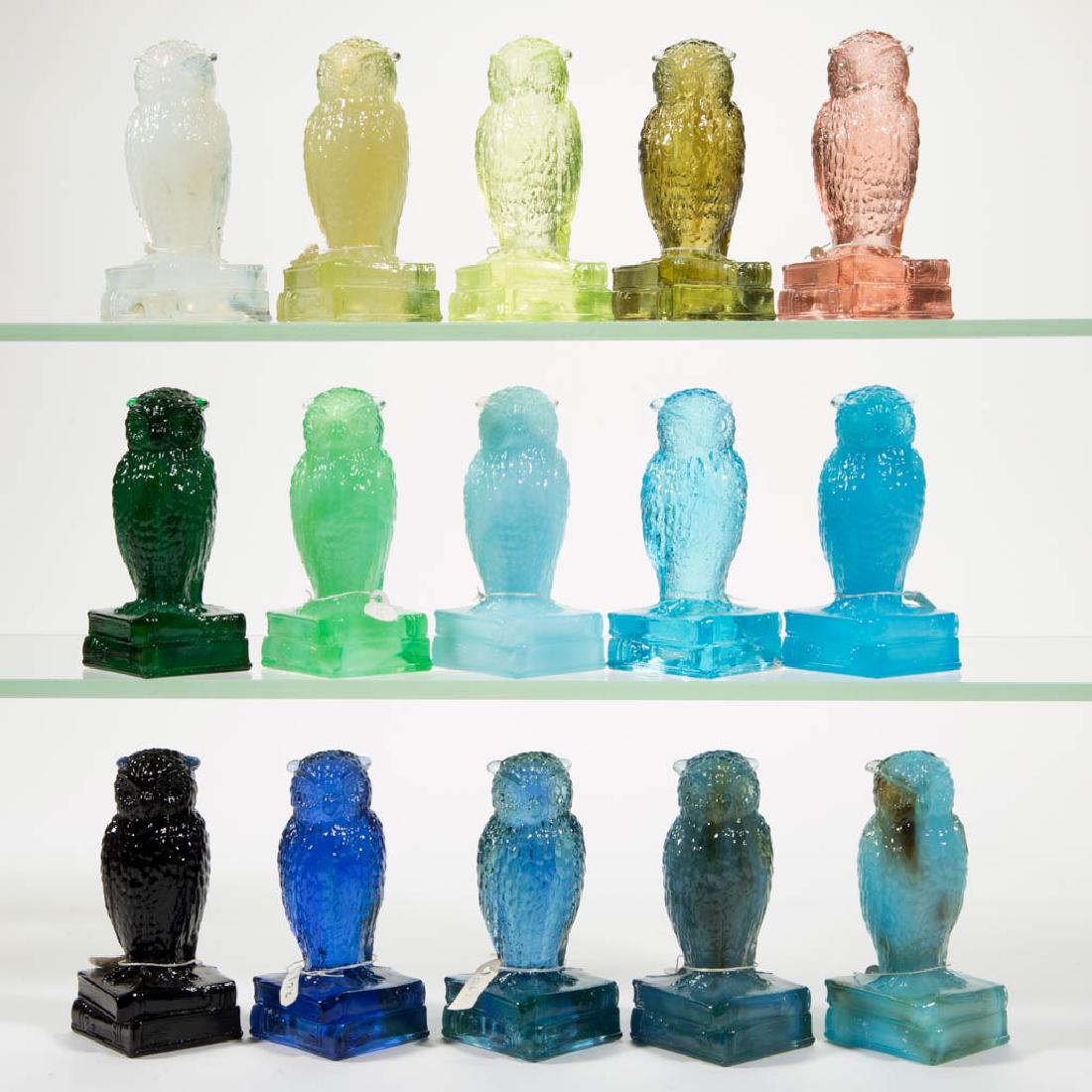 DEGENHART GLASS OWL FIGURES, LOT OF 15: DEGENHART GLASS OWL FIGURES, LOT OF 15, various colors, including a Jade slag, an Opal, a Wonder Blue, and a Vaseline (black lighted). Each with Degenhart "D" mark. Crystal Art Glass Co., Cambridge, O