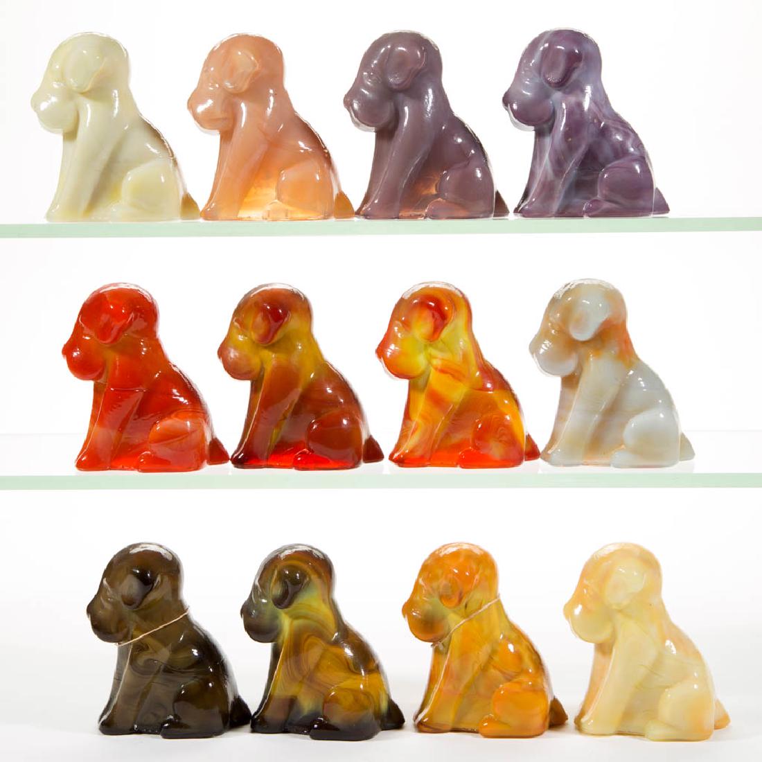 DEGENHART GLASS DOG / POOCH FIGURES, LOT OF 12: DEGENHART GLASS DOG / POOCH FIGURES, LOT OF 12, various colors, including a Bloody Mary / Tomato, a Fantastic, a Bittersweet Slag, an Orchid Slag, and an Ivory Slag example. Each with Degenhart "D" in