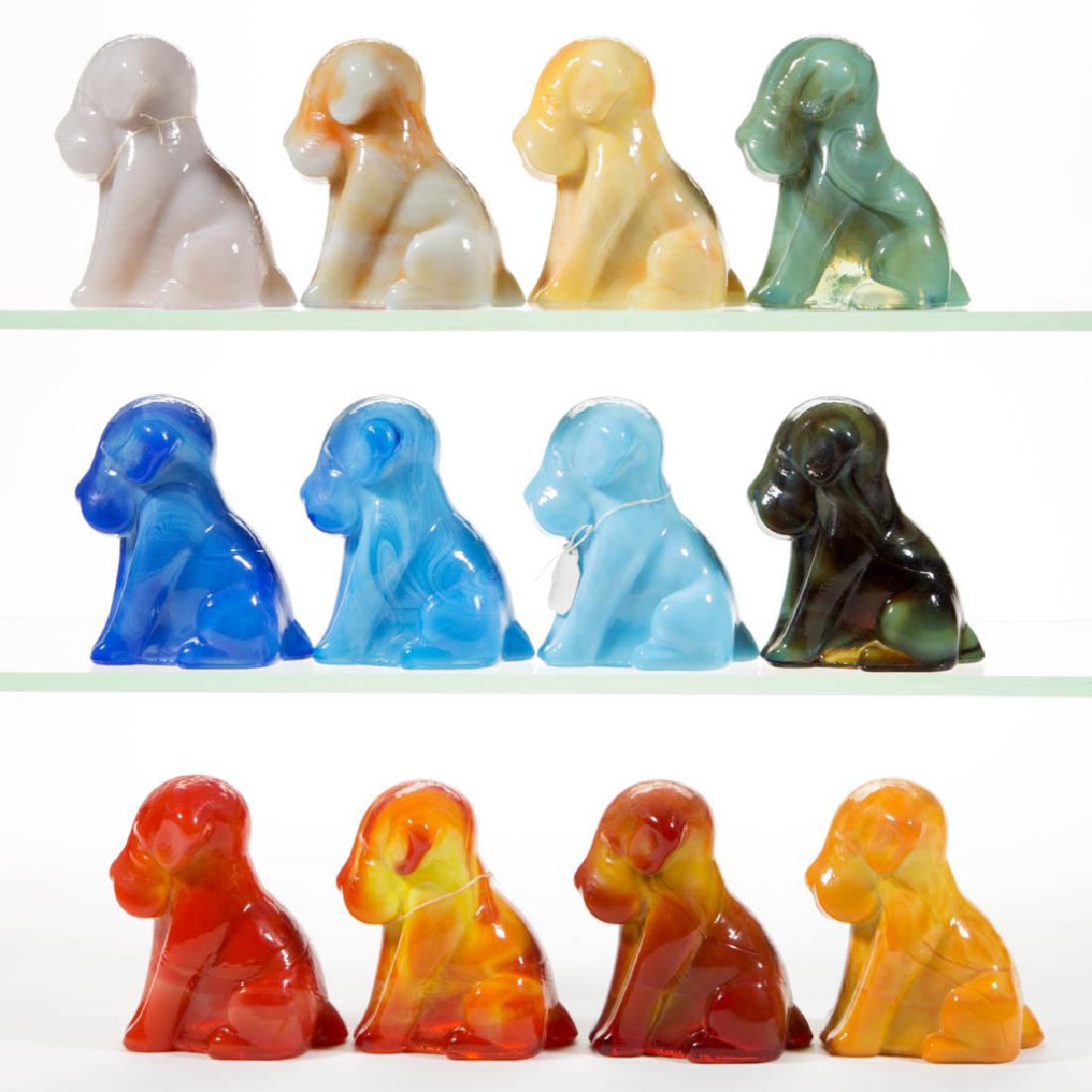 DEGENHART GLASS DOG / POOCH FIGURES, LOT OF 12: DEGENHART GLASS DOG / POOCH FIGURES, LOT OF 12, various colors, including a Bloody Mary / Tomato, a Fantastic, a Bittersweet, a Mauve, and a Milk Blue. Each with Degenhart "D" in heart trademark. Crys