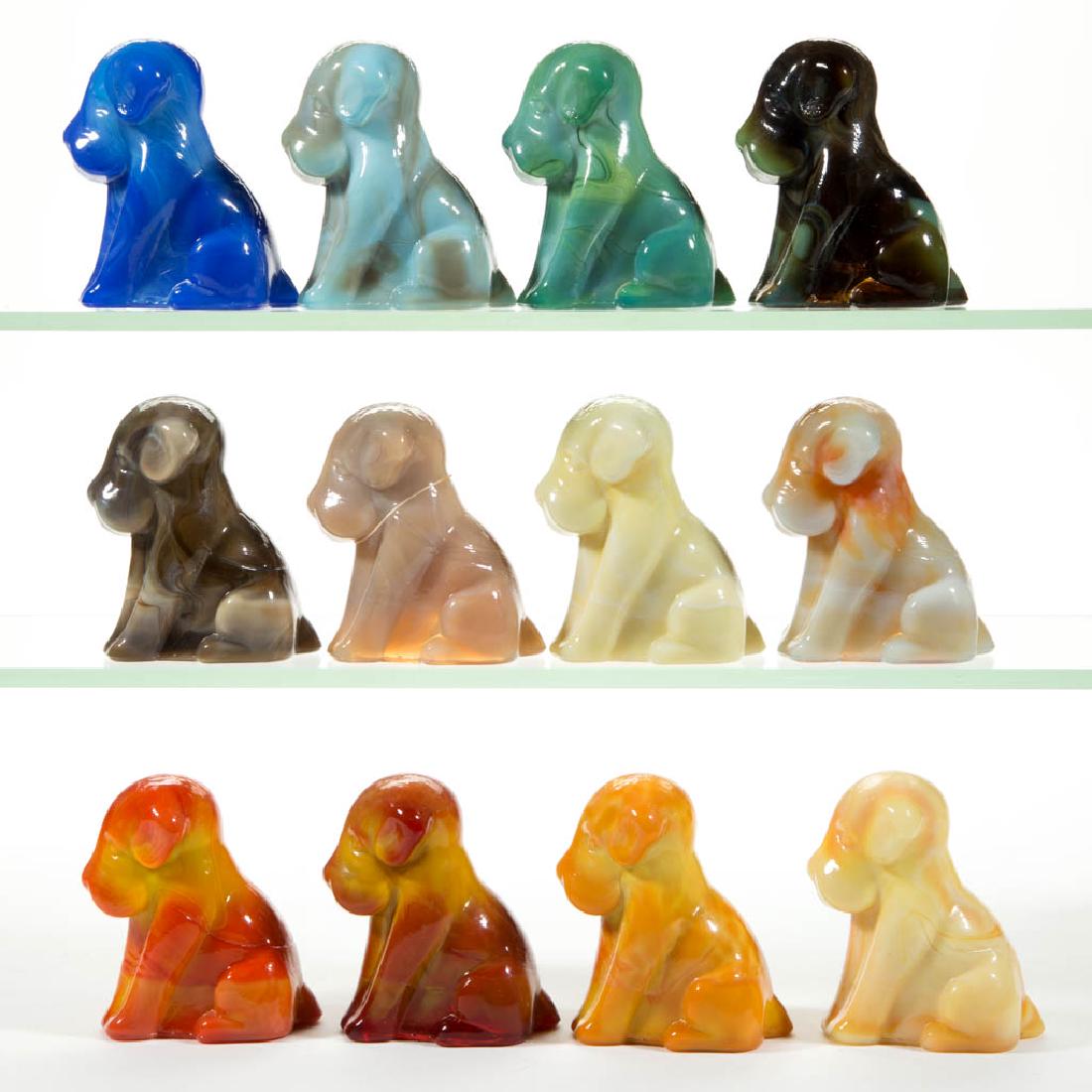 DEGENHART GLASS DOG / POOCH FIGURES, LOT OF 12: DEGENHART GLASS DOG / POOCH FIGURES, LOT OF 12, various colors, including a Bloody Mary / Tomato, a Fantastic, a Bittersweet, and a Custard Slag. Each with Degenhart "D" in heart trademark. Crystal Ar