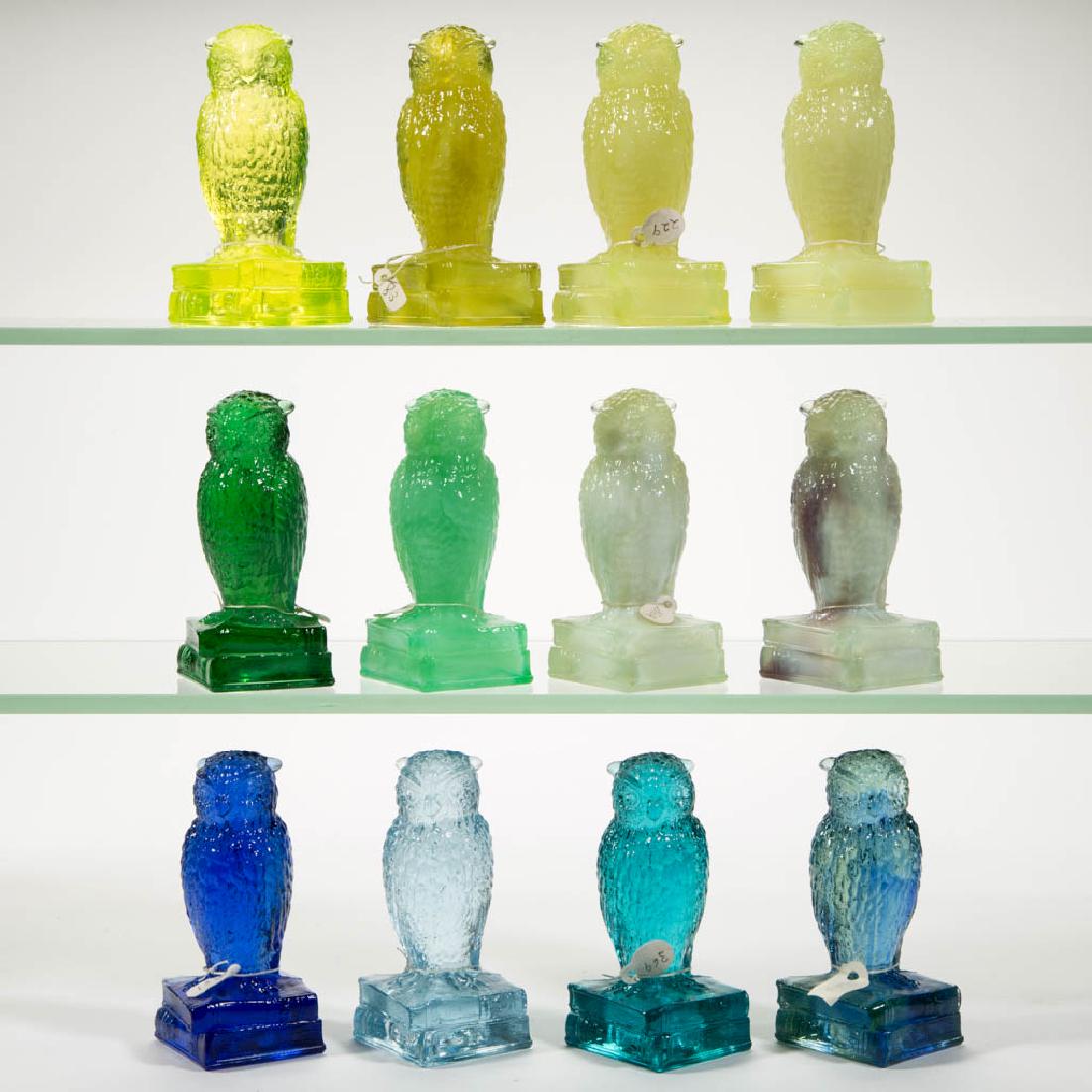 DEGENHART GLASS OWL FIGURES, LOT OF 12: DEGENHART GLASS OWL FIGURES, LOT OF 12, various colors, all of which react to black light, including a Teal, a Cobalt, an Emerald Green, a Vaseline, and a Lemon. Each with Degenhart "D" to underside. 