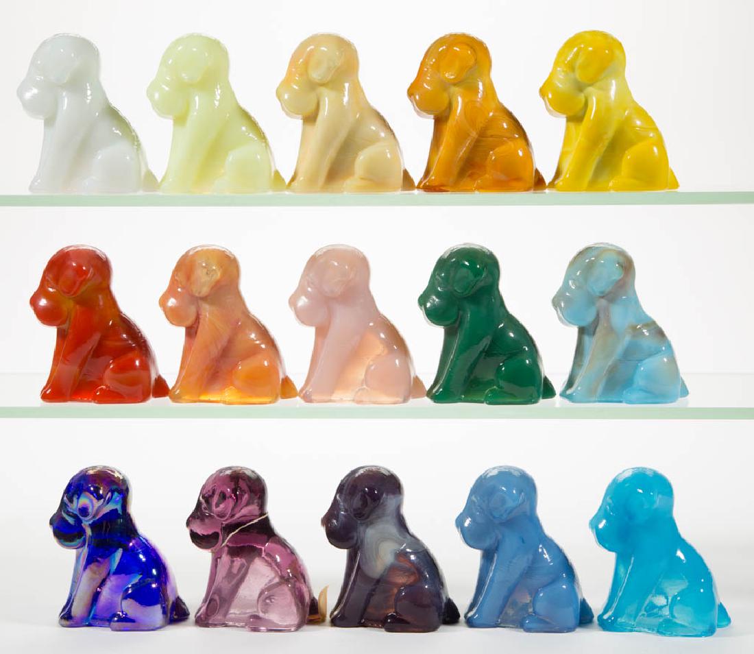 DEGENHART GLASS DOG / POOCH FIGURES, LOT OF 15: DEGENHART GLASS DOG / POOCH FIGURES, LOT OF 15, various colors, including a Bloody Mary / Tomato, a Buttercup, a Tangerine, a Peach Blo, a Daffodil, a Jade, an iridescent Cobalt Carnival, and a Snow W