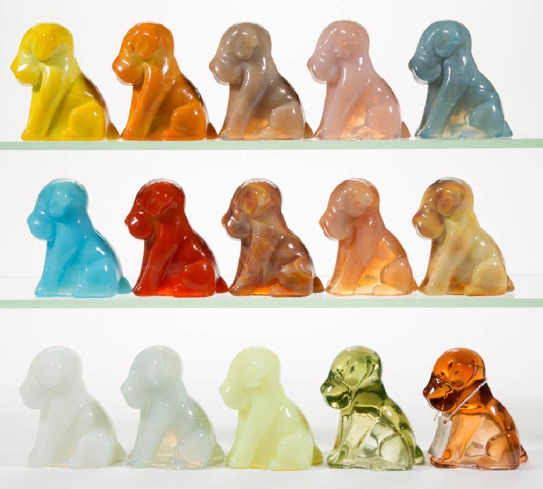 DEGENHART GLASS DOG / POOCH FIGURES, LOT OF 15: DEGENHART GLASS DOG / POOCH FIGURES, LOT OF 15, various colors, including a Bloody Mary / Tomato, a Peach Blo, a Bittersweet Slag, a Tangerine, a Daffodil, an Opal, a Milk Blue, a Snow White, and a Bu