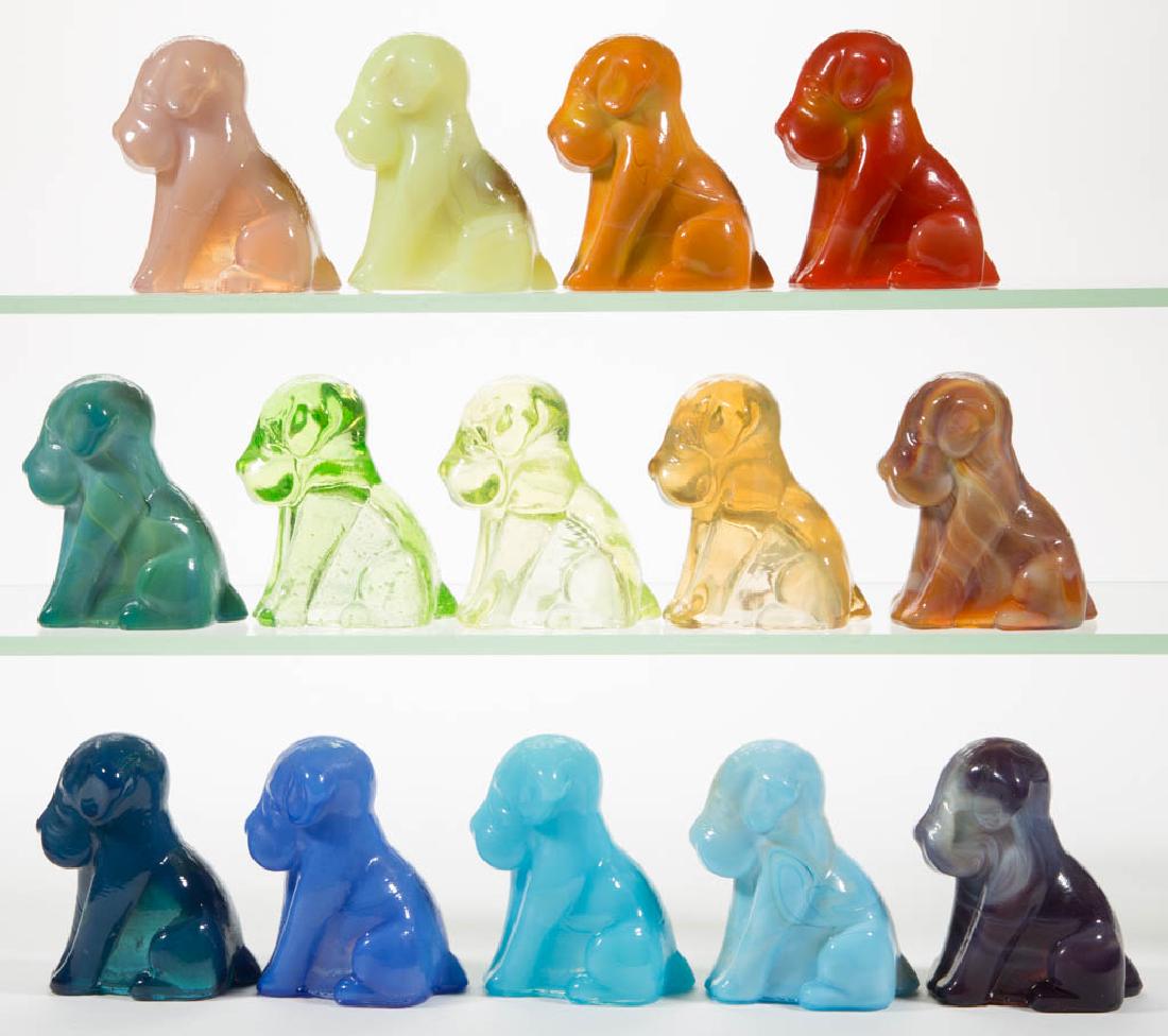 DEGENHART GLASS DOG / POOCH FIGURES, LOT OF 14: DEGENHART GLASS DOG / POOCH FIGURES, LOT OF 14, various colors, including a Bloody Mary / Tomato, a Peach Blo, a Bittersweet Slag, a Daffodil Slag with streaks of lavender, a Milk Blue, a Vaseline (bl