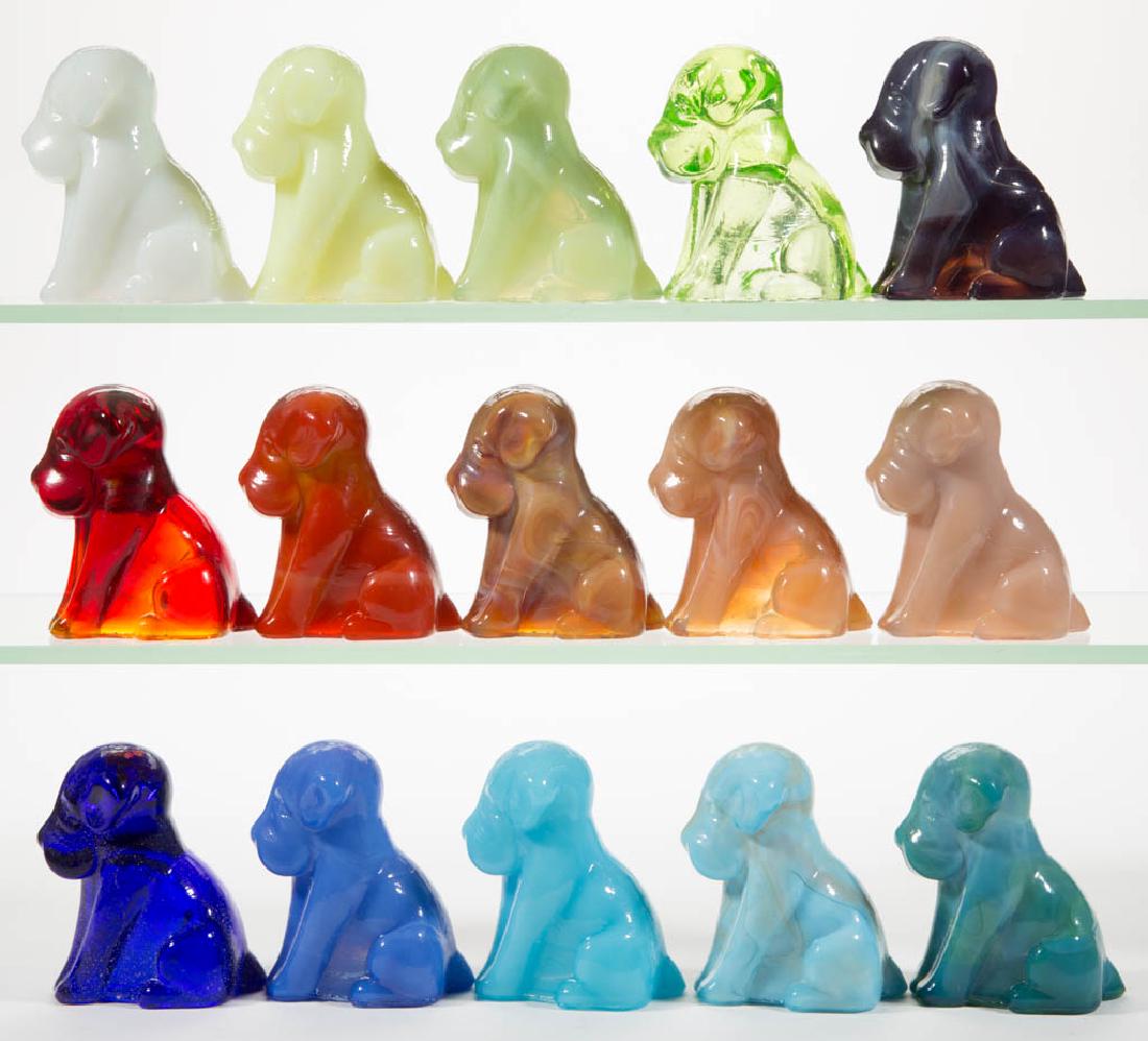 DEGENHART GLASS DOG / POOCH FIGURES, LOT OF 15: DEGENHART GLASS DOG / POOCH FIGURES, LOT OF 15, various colors, including a Bloody Mary / Tomato, a Peach Blo, a Bittersweet Slag, a Tangerine, a Daffodil, a Milk Blue, a Snow White, and an Apple Gree