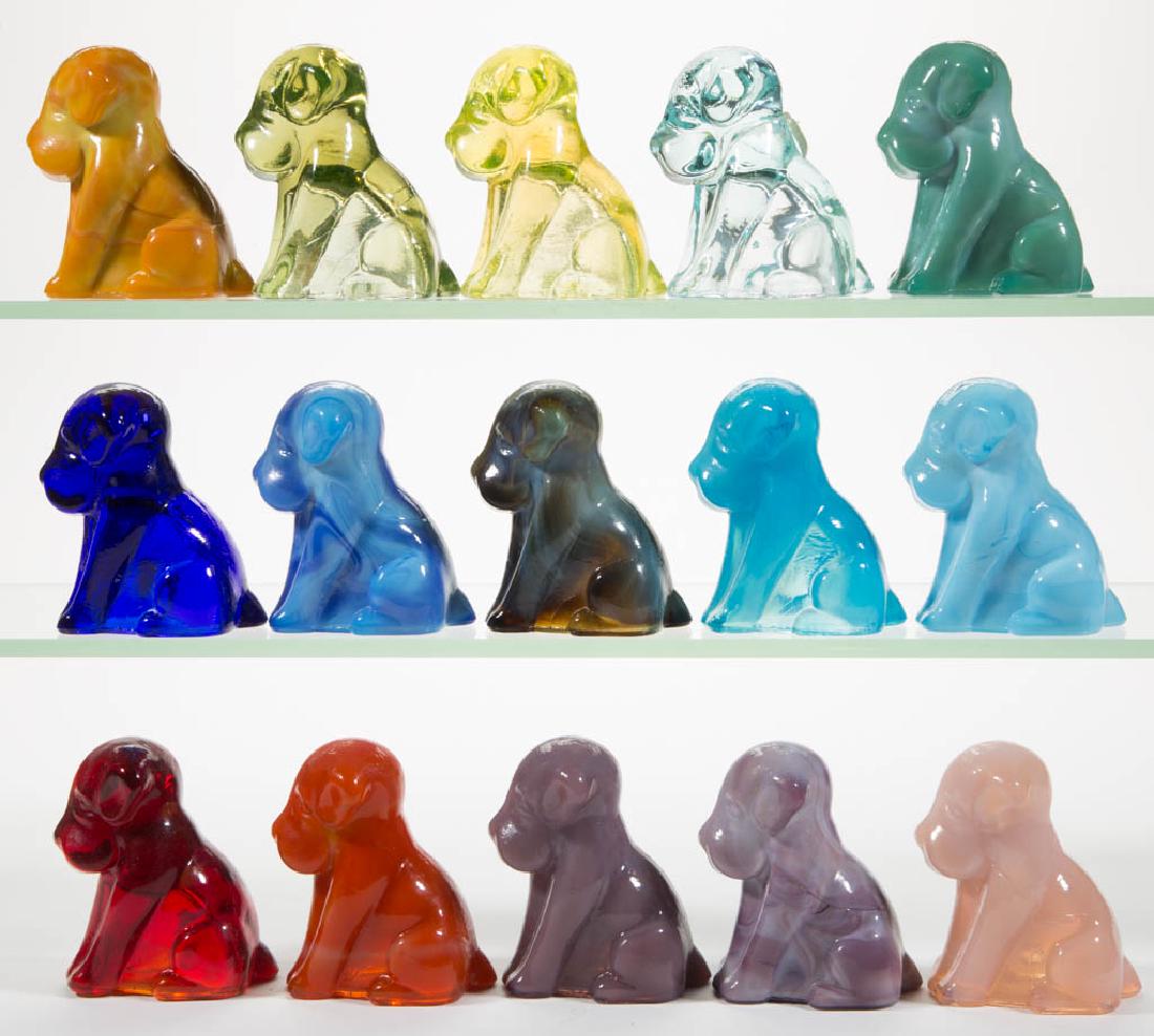 DEGENHART GLASS DOG / POOCH FIGURES, LOT OF 15: DEGENHART GLASS DOG / POOCH FIGURES, LOT OF 15, various colors, including a Bloody Mary / Tomato, a Buttercup Slag, a Cobalt Blue, and an Ice Blue. Each with Degenhart "D" in heart trademark. Crystal 