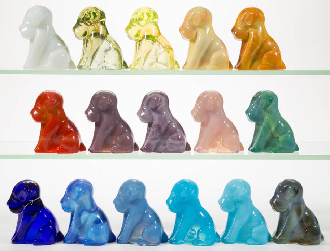 DEGENHART GLASS DOG / POOCH FIGURES, LOT OF 16: DEGENHART GLASS DOG / POOCH FIGURES, LOT OF 16, various colors, including a Bloody Mary / Tomato, a Peach Blo, a Buttercup Slag, a Snow White, a Milk Blue, a Cobalt Blue, and a Canary (black lighted).