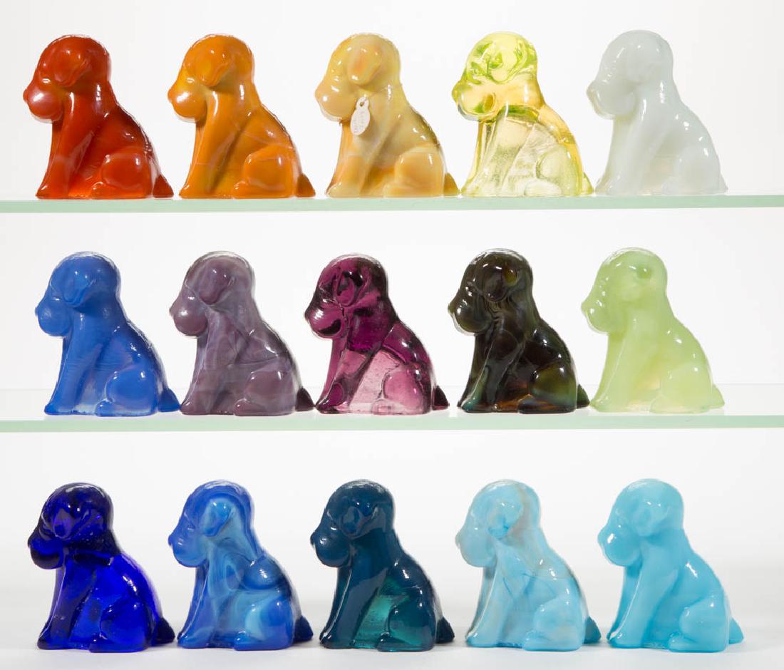 DEGENHART GLASS DOG / POOCH FIGURES, LOT OF 15: DEGENHART GLASS DOG / POOCH FIGURES, LOT OF 15, various colors, including a Bloody Mary / Tomato, a Buttercup Slag, a Daffodil, a Milk Blue, a Cobalt Blue, a Snow White, and a Canary (black lighted). 