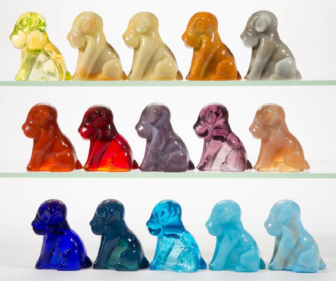 DEGENHART GLASS DOG / POOCH FIGURES, LOT OF 15: DEGENHART GLASS DOG / POOCH FIGURES, LOT OF 15, various colors, including a Bloody Mary / Tomato, a Buttercup Slag, a Milk Blue, a Cobalt Blue, a Tangerine, and a Canary (black lighted). Each with Deg