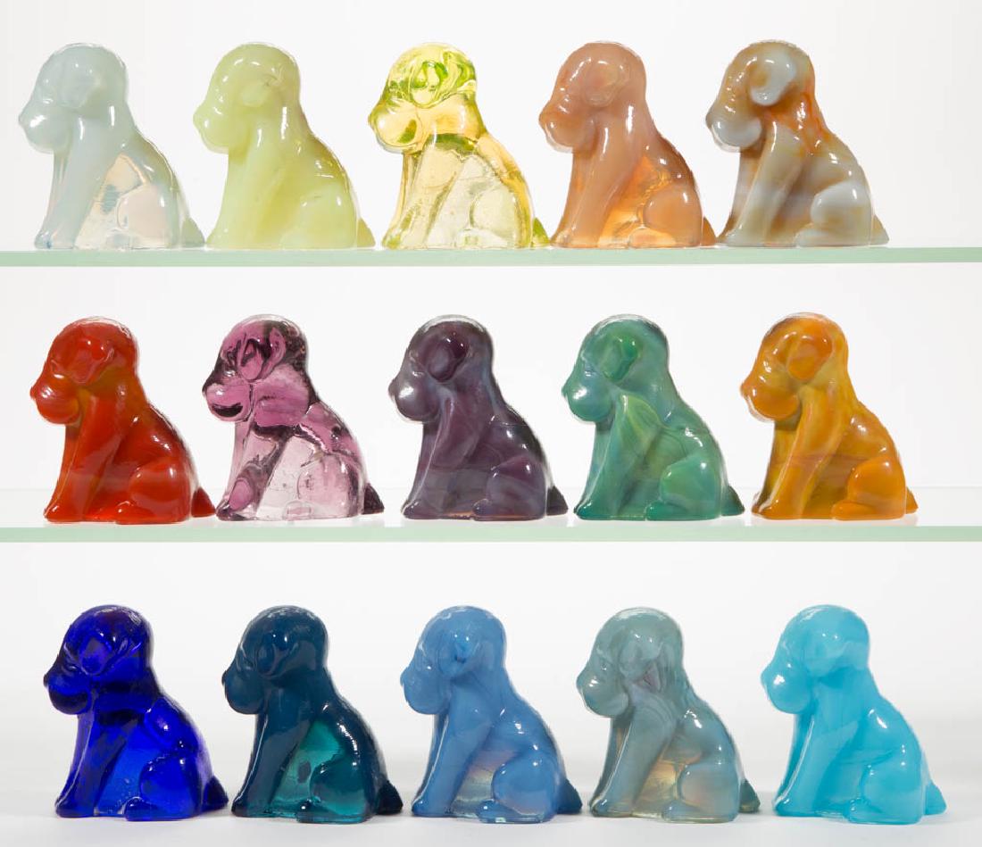 DEGENHART GLASS DOG / POOCH FIGURES, LOT OF 15: DEGENHART GLASS DOG / POOCH FIGURES, LOT OF 15, various colors, including a Bloody Mary / Tomato, a Buttercup Slag, a Tangerine, a Daffodil Slag with very light streaks of lavender, a Milk Blue, a Cob