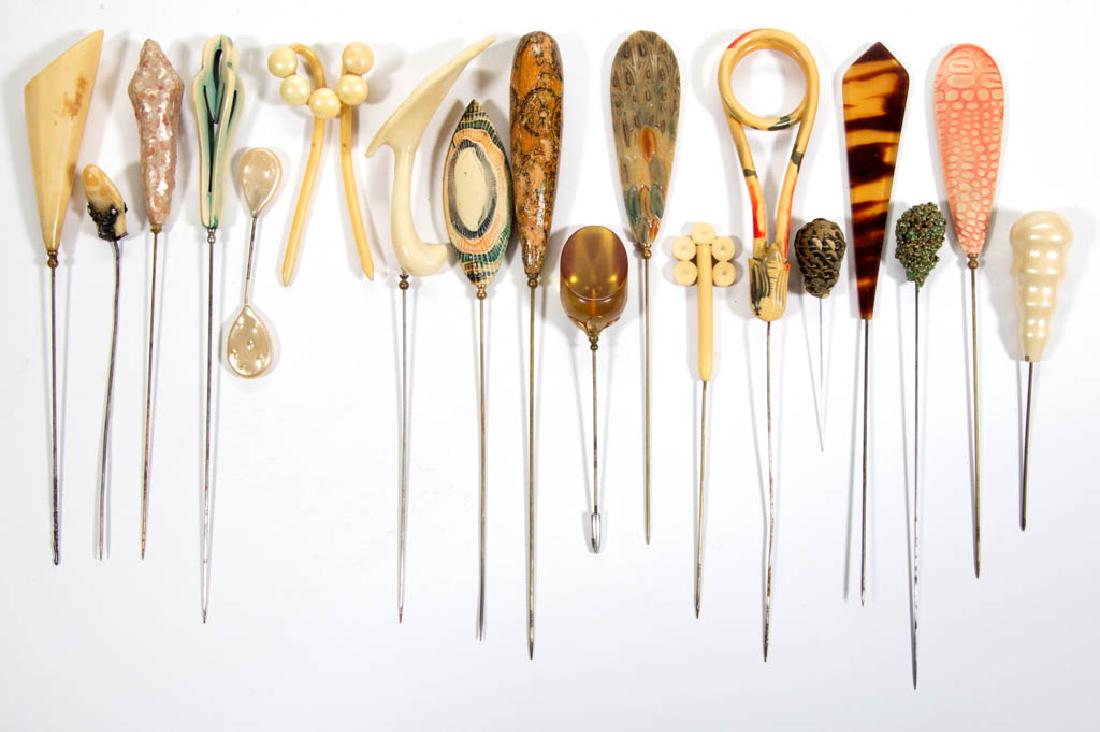 VINTAGE ASSORTED HATPINS, LOT OF 18: VINTAGE ASSORTED HATPINS, LOT OF 18, comprising ten celluloid/Bakelite/early plastics, two painted wood, three beaded/sequined, two Lucite, and one with 29mm chamois tooth, most knopped collars with s