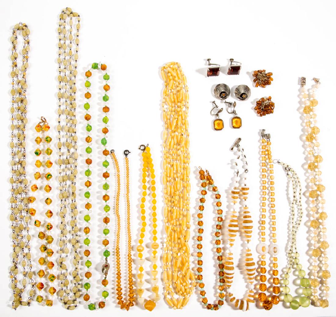 ASSORTED ANTIQUE / VINTAGE FACETED / MOLDED GLASS BEAD: ASSORTED ANTIQUE / VINTAGE FACETED / MOLDED GLASS BEAD COSTUME JEWELRY, LOT OF 20, most having yellow coloring, comprising four pairs of earrings and 12 necklaces, some with various clasps. Unmarked.