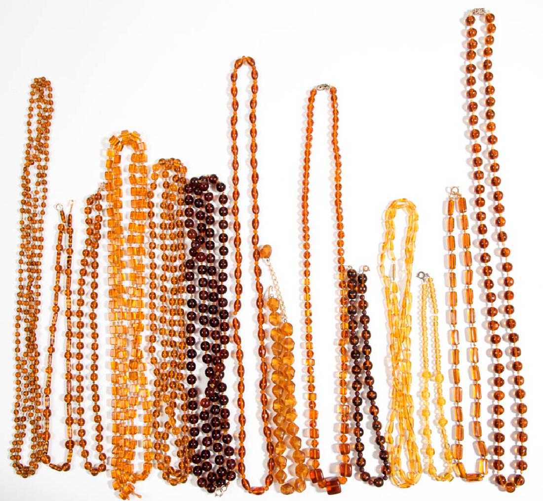 ASSORTED ANTIQUE / VINTAGE FACETED / MOLDED GLASS BEAD: ASSORTED ANTIQUE / VINTAGE FACETED / MOLDED GLASS BEAD COSTUME JEWELRY NECKLACES, LOT OF 14, all mostly having translucent amber/brown coloring, some with various clasps. Unmarked. 20th century. 15" t