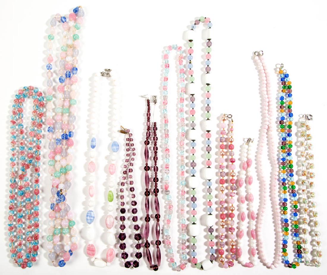 ASSORTED ANTIQUE / VINTAGE FACETED / MOLDED GLASS BEAD: ASSORTED ANTIQUE / VINTAGE FACETED / MOLDED GLASS BEAD COSTUME JEWELRY NECKLACES, LOT OF 12, polychrome coloring, some with various clasps. Unmarked. 20th century. 15" to 56" LOA.No apparent damage.Pr