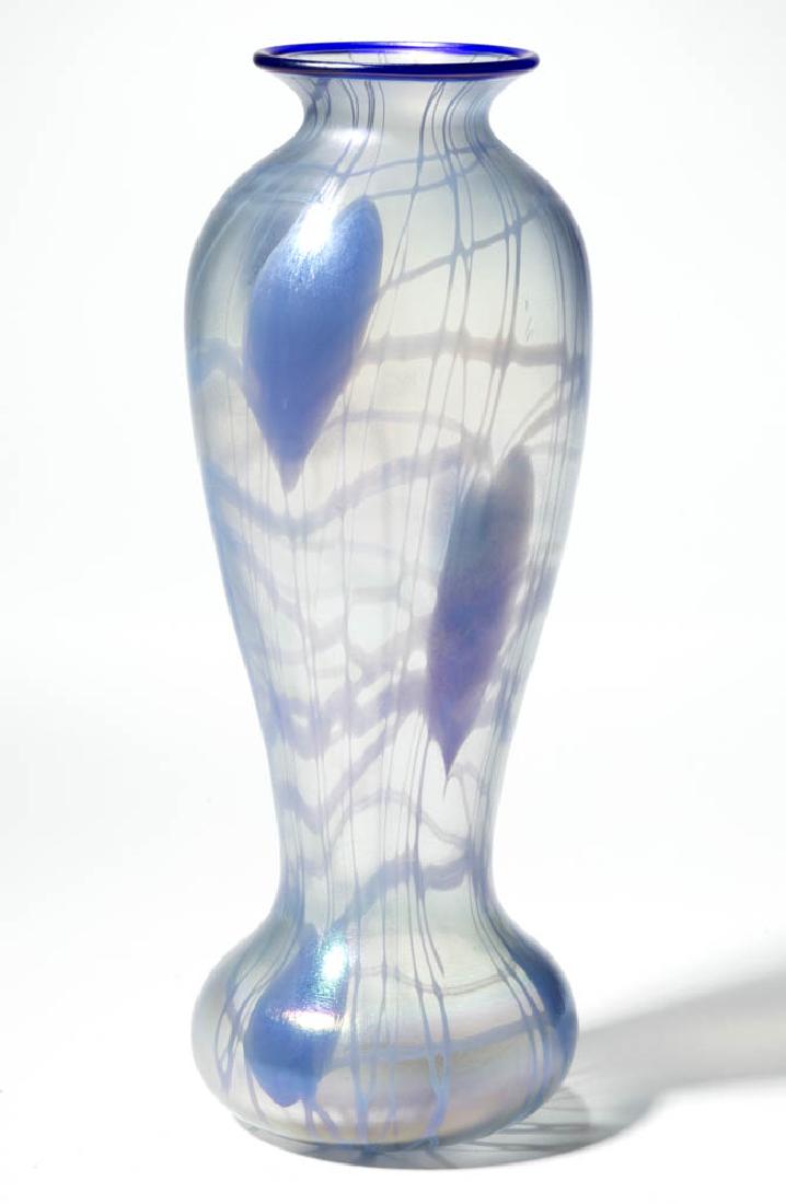IMPERIAL FREE HAND HEART AND VINE ART GLASS VASE: IMPERIAL FREE HAND HEART AND VINE ART GLASS VASE, colorless iridescent with pale blue decoration, Free Hand No. 279, applied cobalt blue rim, polished pontil mark. Imperial Glass Co. Circa 1925. 10" H