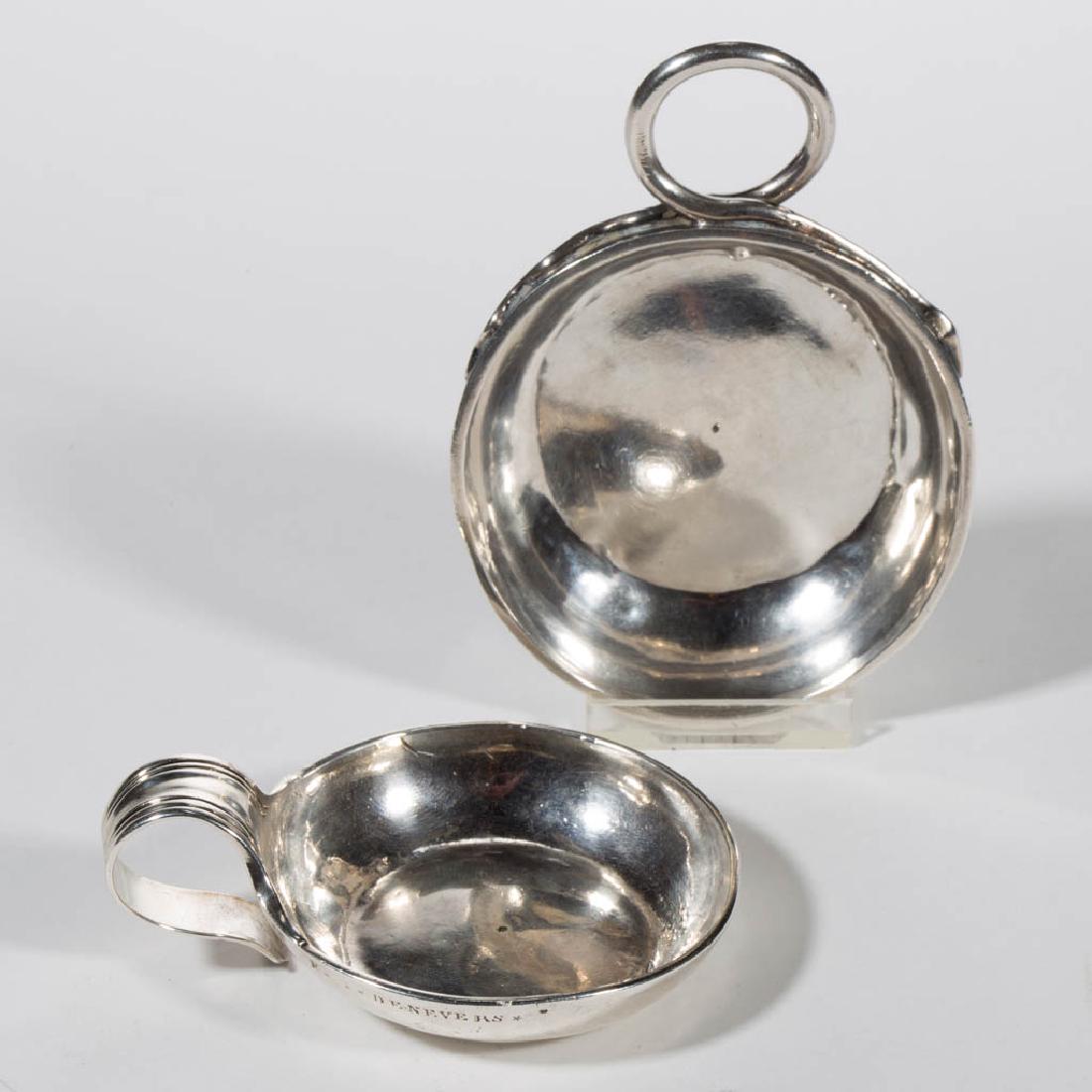 FRENCH SILVER WINE TASTERS / TASTEVIN, LOT OF TWO: FRENCH SILVER WINE TASTERS / TASTEVIN, LOT OF TWO, comprising one example with applied loop handle in the form of a snake, incised "J. BUCHER. D. L. C." with stars/asterisks flanking, partially legibl
