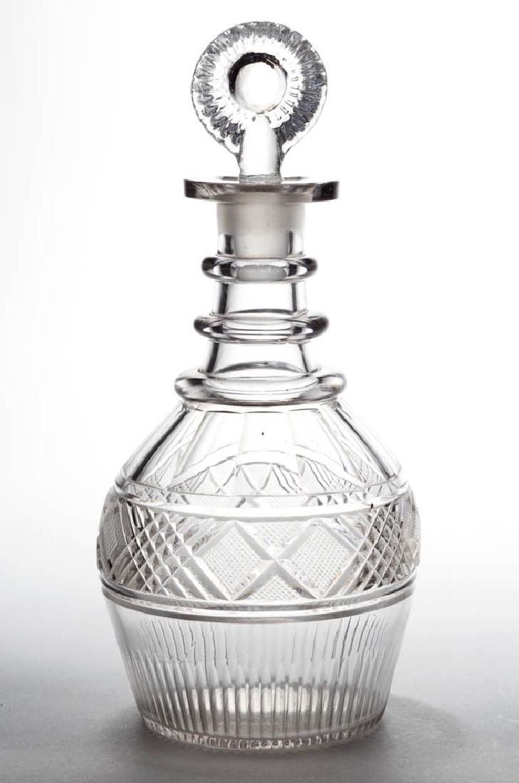 CUT STRAWBERRY DIAMOND AND CROSSHATCH DIAMOND QUART: CUT STRAWBERRY DIAMOND AND CROSSHATCH DIAMOND QUART DECANTER, colorless, Prussian form with shoulder panels and basal flutes, three applied neck rings, factory-polished mouth, and polished pontil mark