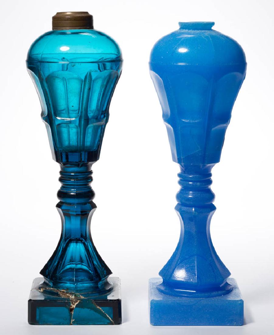 PRESSED BIGLER WHALE OIL / FLUID STAND LAMPS, LOT OF: PRESSED BIGLER WHALE OIL / FLUID STAND LAMPS, LOT OF TWO, deep teal and translucent starch blue, each with a dome-top conical font with a short extension, raised on double-knop stems, octagonal balust