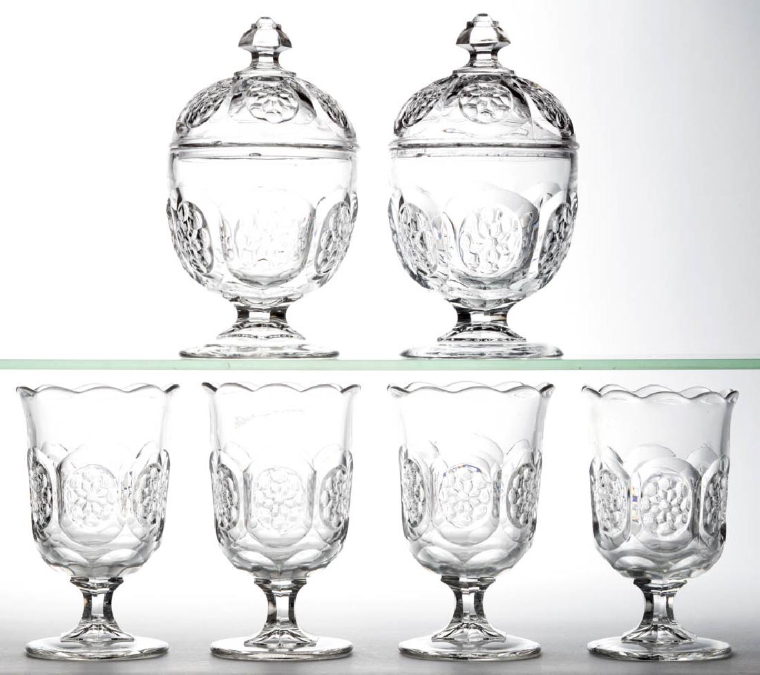 FLOWER MEDALLION TABLE ARTICLES, LOT OF SIX: FLOWER MEDALLION TABLE ARTICLES, LOT OF SIX, colorless lead glass, comprising two covered sugar bowls and four spooner holders. Boston & Sandwich Glass Co. 1865-1880. Sugar Bowls: 7 1/4" HOA. Spooners
