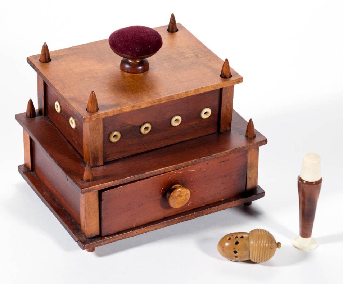 ASSORTED SEWING ARTICLES, LOT OF THREE: ASSORTED SEWING ARTICLES, LOT OF THREE, comprising a poplar two-tier sewing/work box, lift-off top with pin cushion, concealing thread pegs, sides with bone eyelets for thread dispensing, base with a 