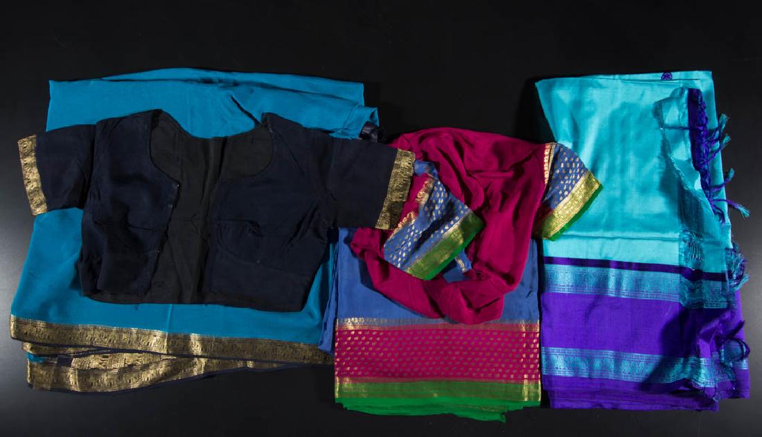 INDONESIAN SILK SAREES, LOT OF THREE: INDONESIAN SILK SAREES, LOT OF THREE, one with fringe, two with gold accents have matching tops. Five pieces total. Circa 1960. Excellent condition. Provenance: Descended in the Woodring family of Top