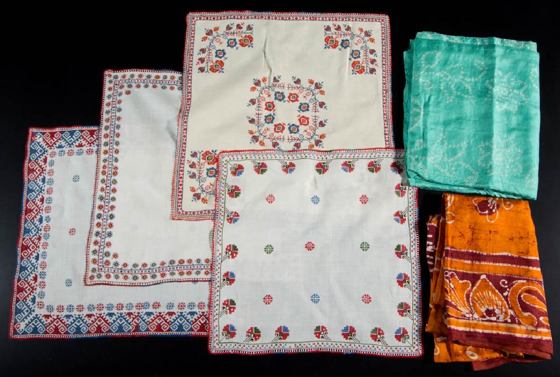 ASSORTED ETHNIC TEXTILES: ASSORTED ETHNIC TEXTILES, uncounted lot, including two Egyptian applique table runners, four finely embroidered mats, a batik sarong, various lace, etc. 20th century. Most in excellent condition.Prove