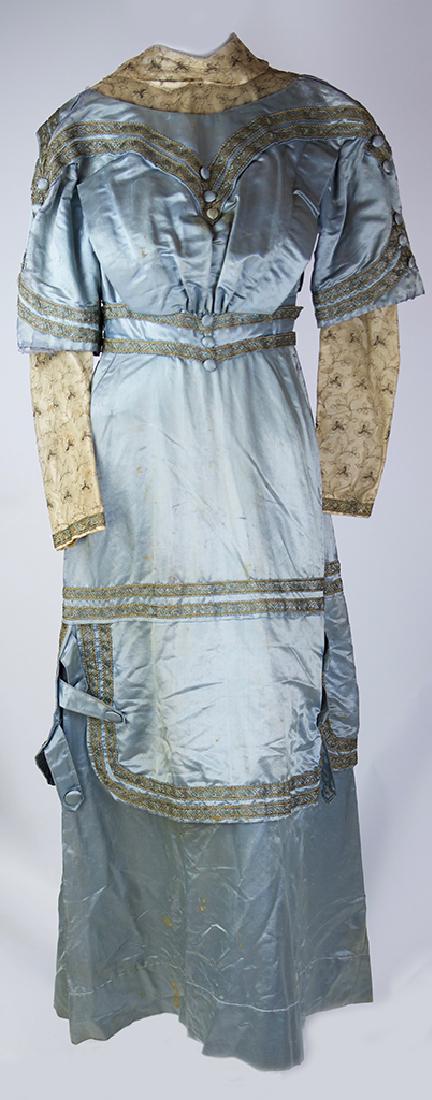 EDWARDIAN BLUE SILK AND LACE WEDDING DRESS: EDWARDIAN BLUE SILK AND LACE WEDDING DRESS, celluloid-boned standing collar, bodice with natural waist and upper sleeves trimmed in horsehair braid, metallic gold embroidered mesh lace undersleeves, p