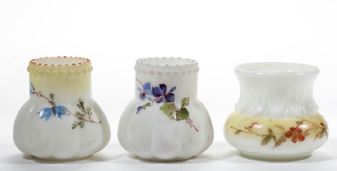 LITTLE LOBES TOOTHPICK HOLDERS, LOT OF TWO: LITTLE LOBES TOOTHPICK HOLDERS, LOT OF TWO, opaque white with polychrome-enamel decoration, each with floral decoration and a beaded rim, one with shaded yellow toward the rim. Together with a Wave Cr