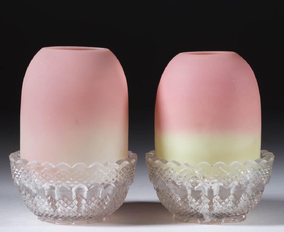 WEBB BURMESE FAIRY LAMPS, LOT OF TWO: WEBB BURMESE FAIRY LAMPS, LOT OF TWO, plush finish, each pyramid-size shades resting in colorless S. Clarke's Fairy Pyramid lamp cups. Thomas Webb & Sons. Late 19th/early 20th century. 3 3/4" HOA.One