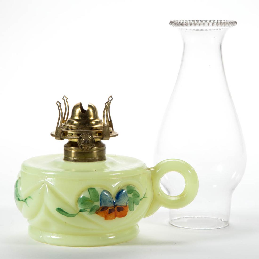 HEART KEROSENE FINGER LAMP: HEART KEROSENE FINGER LAMP, custard (reacts under black light) with polychrome-enamel floral decoration, No. 1 Taplin-Brown collar. Fitted with a period No. 0 "QUEEN ANNE" slip burner and colorless ch