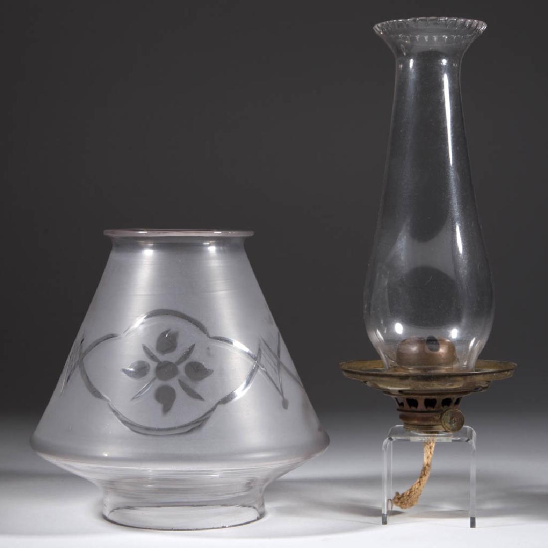 E. MILLER NO. 2 LIP BURNER WITH SETUP: E. MILLER NO. 2 LIP BURNER WITH SETUP, comprising a burner with elevator feature, shade ring, colorless lip chimney with scalloped top, and a colorless and frosted cut and engraved conical-form shade 