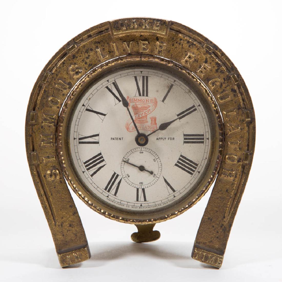 SIMMONS LIVER REGULATOR CAST-IRON ADVERTISING CLOCK (1 of 2)