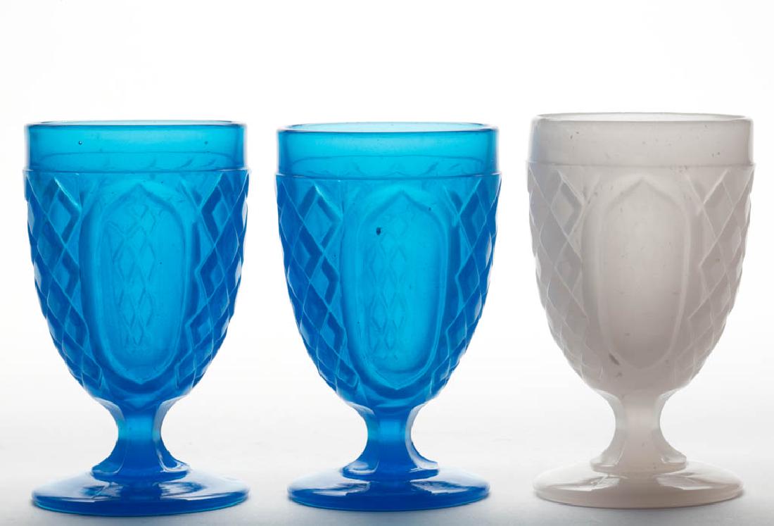 LATTICE AND OVALS / FLAT DIAMOND AND PANEL (OMN) EGG: LATTICE AND OVALS / FLAT DIAMOND AND PANEL (OMN) EGG CUPS / POMADES, LOT OF THREE, comprising two translucent starch blue and an alabaster clambroth example. Boston & Sandwich Glass Co. and probably o