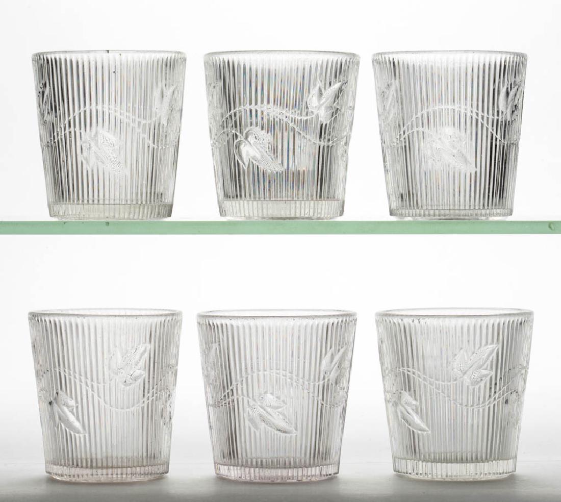 RIBBED IVY WHISKEY TUMBLERS, LOT OF SIX: RIBBED IVY WHISKEY TUMBLERS, LOT OF SIX, colorless lead glass. Boston & Sandwich Glass Co. and others. 1855-1870. 2 3/4" H. One with a minute flake to the base edge, remainder undamaged. Provenance: F