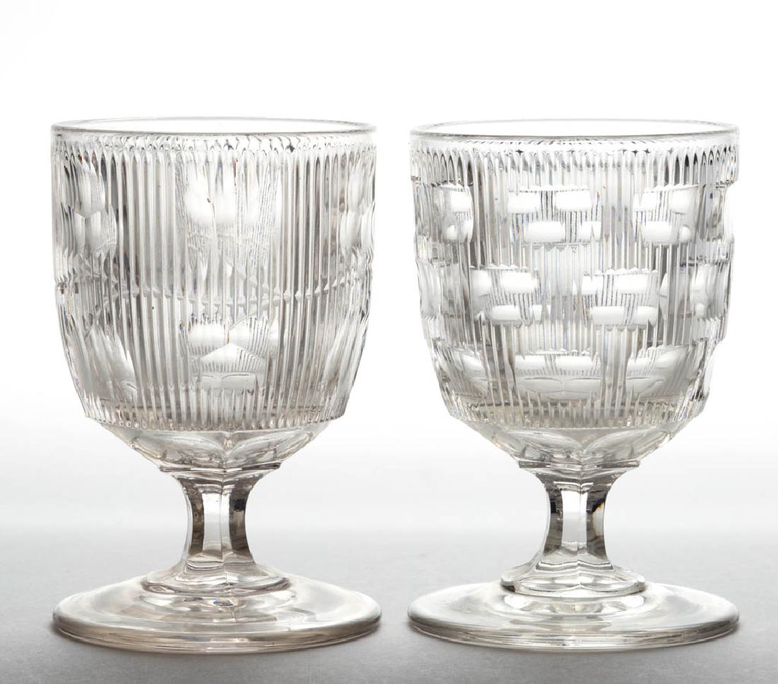 ASSORTED CUT FLINT EAPG EGG CUPS, LOT OF TWO: ASSORTED CUT FLINT EAPG EGG CUPS, LOT OF TWO, colorless lead glass, comprising a Fine Rib with Cut Ovals and a Cut Bellflower example. Boston & Sandwich Glass Co., New England Glass Co., and possibly