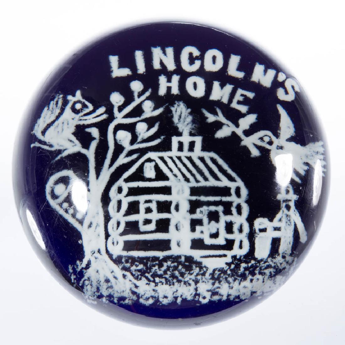 LINCOLN'S HOME FRIT MAGNUM PAPERWEIGHT: LINCOLN'S HOME FRIT MAGNUM PAPERWEIGHT, white frit decoration depicting Abraham Lincoln's home with a squirrel and flying bird, cobalt blue ground, factory-polished base. Maker unverified. First half 