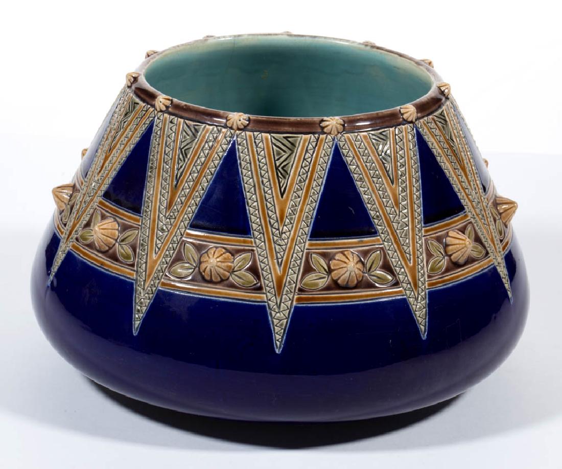 SARREGUEMINES MAJOLICA JARDINIERE: SARREGUEMINES MAJOLICA JARDINIERE, cobalt ground with polychrome geometric designs, raised points around rim and body. Impressed "SARREGUEMINES / 876 / 124 / S" mark to base. Late 19th/early 20th cent