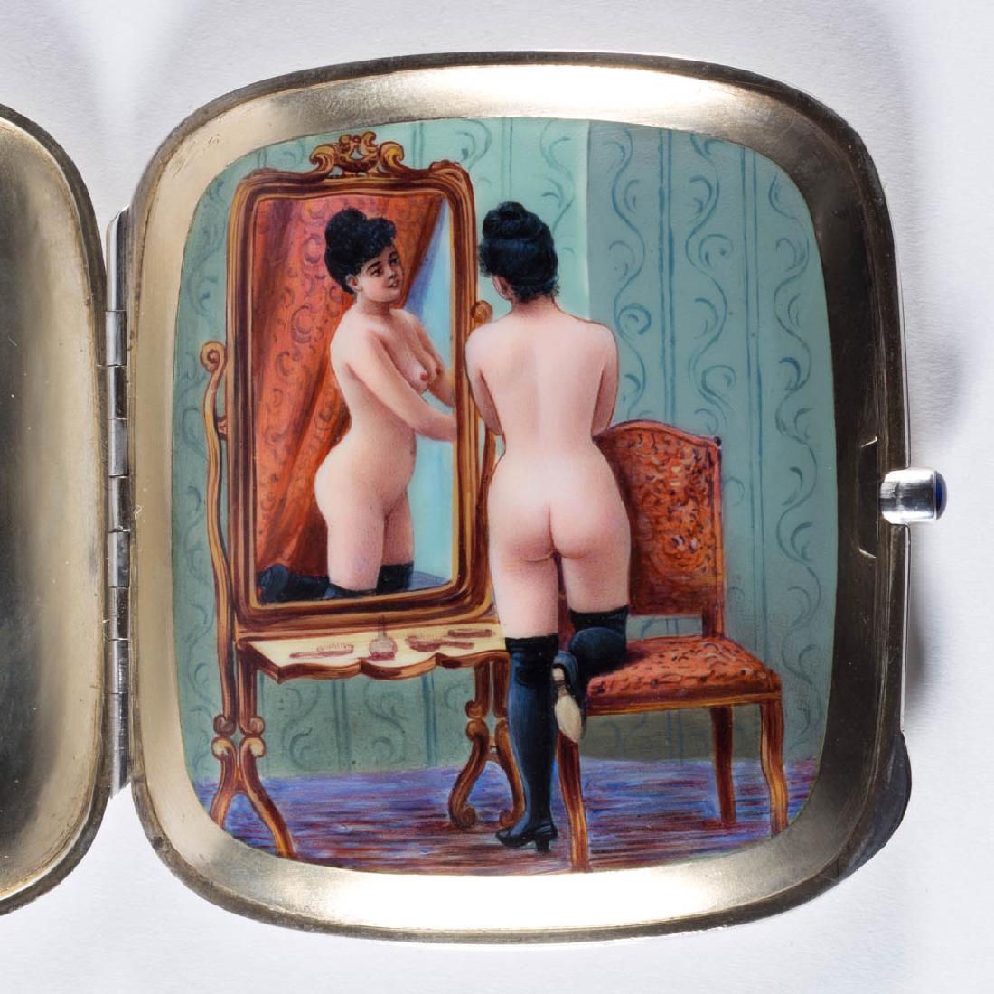 CONTINENTAL STERLING SILVER AND ENAMEL CONCEALED EROTIC: CONTINENTAL STERLING SILVER AND ENAMEL CONCEALED EROTIC CIGARETTE CASE, blue cabochon push-button release for lid, featuring hand-painted polychrome enamel portrait of a nude woman in a well-appointed
