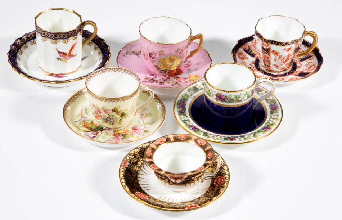ENGLISH DEMITASSE PORCELAIN CUP AND SAUCER SETS, LOT OF: ENGLISH DEMITASSE PORCELAIN CUP AND SAUCER SETS, LOT OF SIX, comprising five with floral motifs and one with polychrome bird motif, all with gilt decoration. Printed marks include "MINTONS", "ROYAL WO
