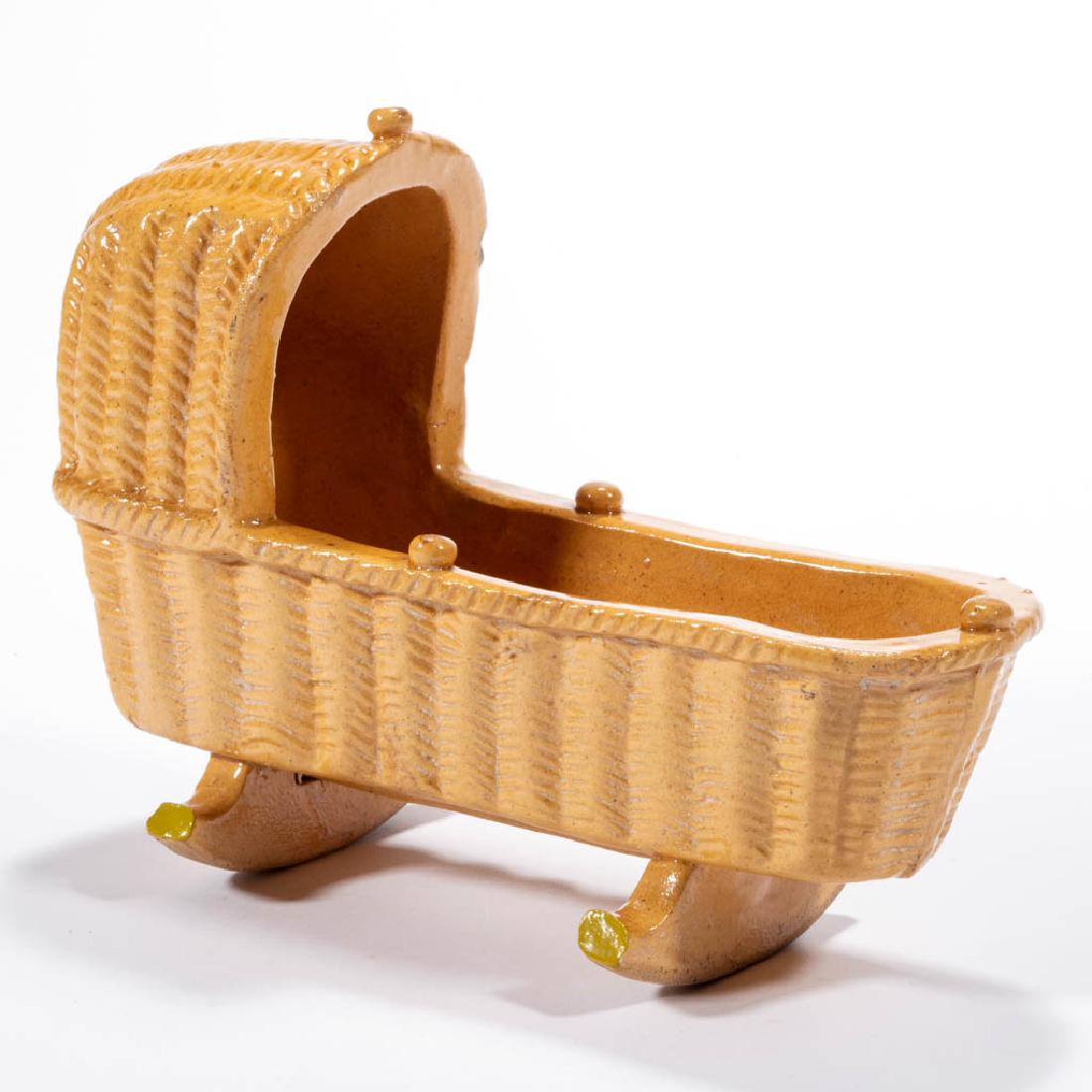 ENGLISH YELLOWWARE CERAMIC CRADLE FIGURE (1 of 3)