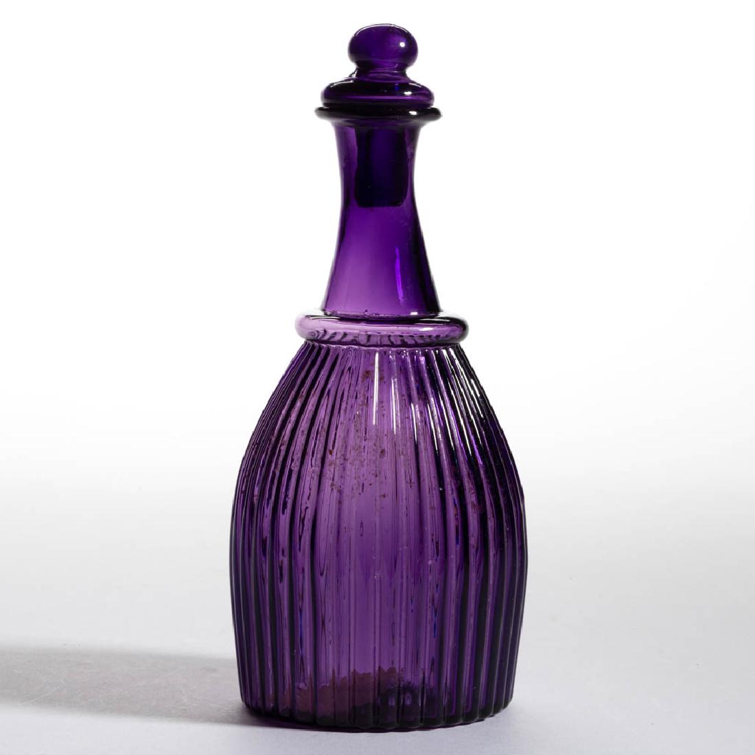 BLOWN-MOLDED GI-7 TYPE II CRUET / TOILET BOTTLE: BLOWN-MOLDED GI-7 TYPE II CRUET / TOILET BOTTLE, amethyst, plain flanged mouth above an unpatterned neck, plain base with rough pontil mark, matching hollow Tam-O'-Shanter stopper. Probably Boston & S