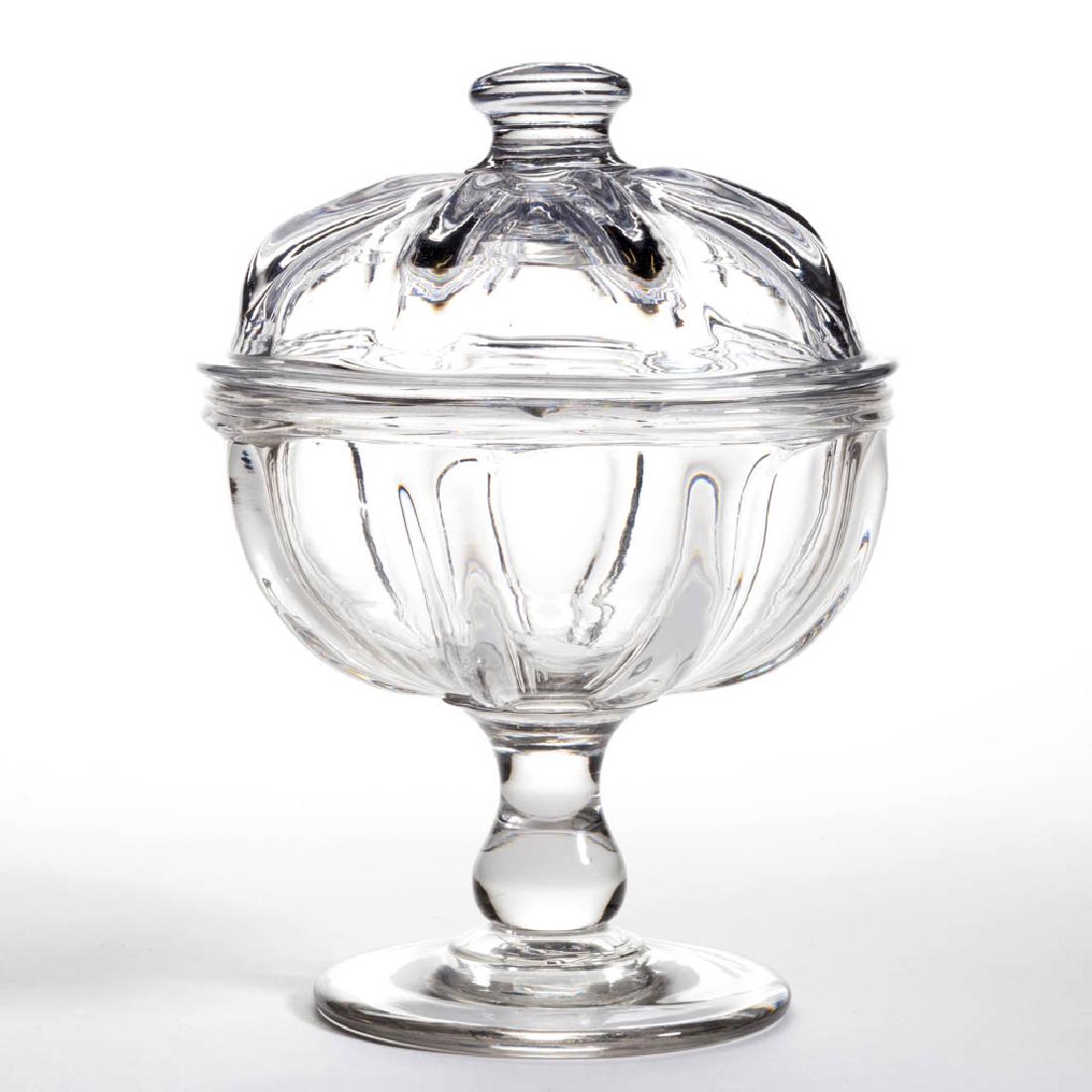 PILLAR-MOLDED COVERED COMPOTE: PILLAR-MOLDED COVERED COMPOTE, colorless, hemispherical bowl with eight pronounced ribs and heavy tooled rim, raised on an applied solid baluster-form stem and thick circular foot with a rough pontil 