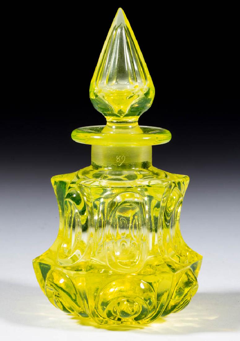 LOOP AND FRAMED CONVEX OVALS COLOGNE BOTTLE: LOOP AND FRAMED CONVEX OVALS COLOGNE BOTTLE, bright canary (reacts under black light), low and waisted hexagonal form with a short neck, thick flanged mouth, and polished base, original hexagonal flut