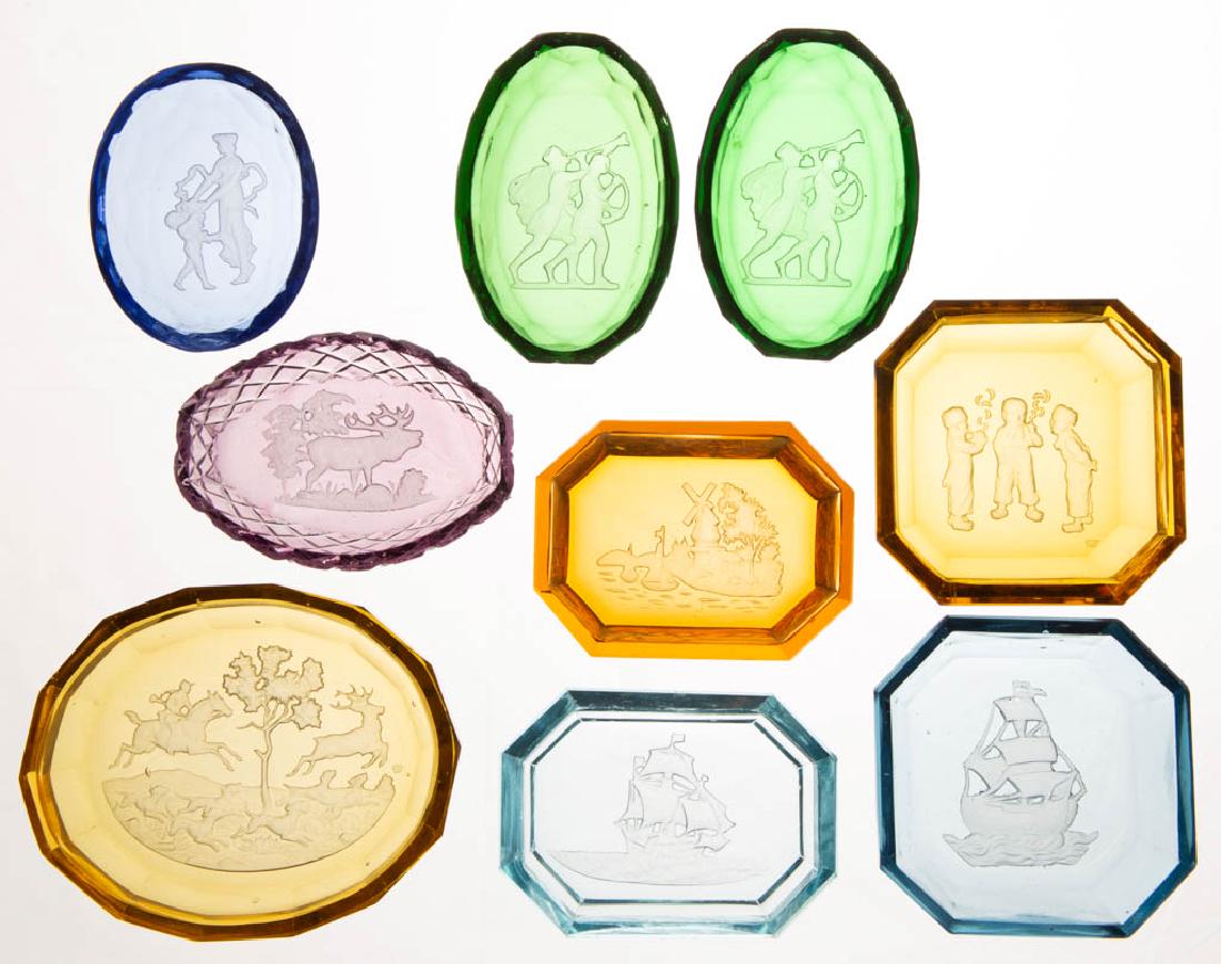 ASSORTED CZECH GLASS OPEN SALTS, LOT OF NINE: ASSORTED CZECH GLASS OPEN SALTS, LOT OF NINE, various colors, each with a frosted design to the center on the underside, factory-polished rims. 20th century. 1/2" to 3/4" H. Light blue with a single f