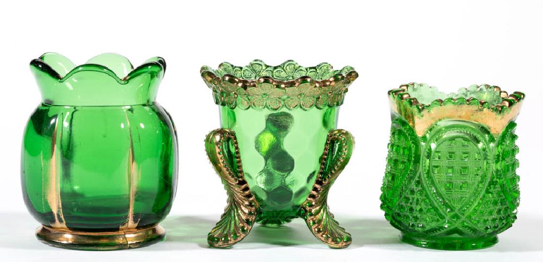 ASSORTED EAPG TOOTHPICK HOLDERS, LOT OF THREE: ASSORTED EAPG TOOTHPICK HOLDERS, LOT OF THREE, green with gilt decoration, comprising Vermont, Heisey Fancy Loop, and X-Ray examples. Various makers. Fourth quarter 19th/first quarter 20th century. 2