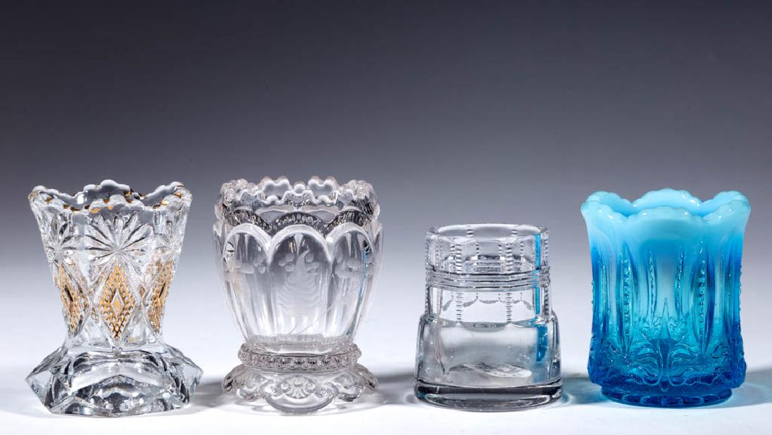 ASSORTED EAPG TOOTHPICK HOLDERS, LOT OF THREE: ASSORTED EAPG TOOTHPICK HOLDERS, LOT OF THREE, colorless, comprising Shoshone, Duncan Zipper Edge, and Riverside Empress with engraved decoration. Together with a blue opalescent Iris with Meander too