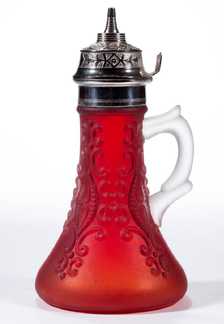 SYNORA LACE SYRUP PITCHER: SYNORA LACE SYRUP PITCHER, ruby with a satin finish, molded frosted colorless handle, original lid. Ohio Flint Glass Works. Circa 1901. 8" HOA. Undamaged. Literature: Heacock - Book III: Syrups, Sugar