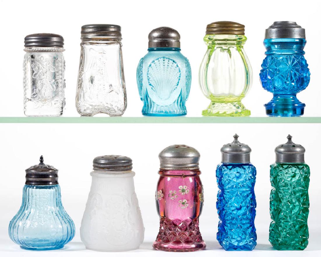 ASSORTED EAPG SALT AND PEPPER SHAKERS, LOT OF TEN: ASSORTED EAPG SALT AND PEPPER SHAKERS, LOT OF TEN, various colors, including three Daisy and Button, a Wild Rose and Bowknot, and a Scrolling Ivy, each with a period lid. Various makers. Fourth quarte